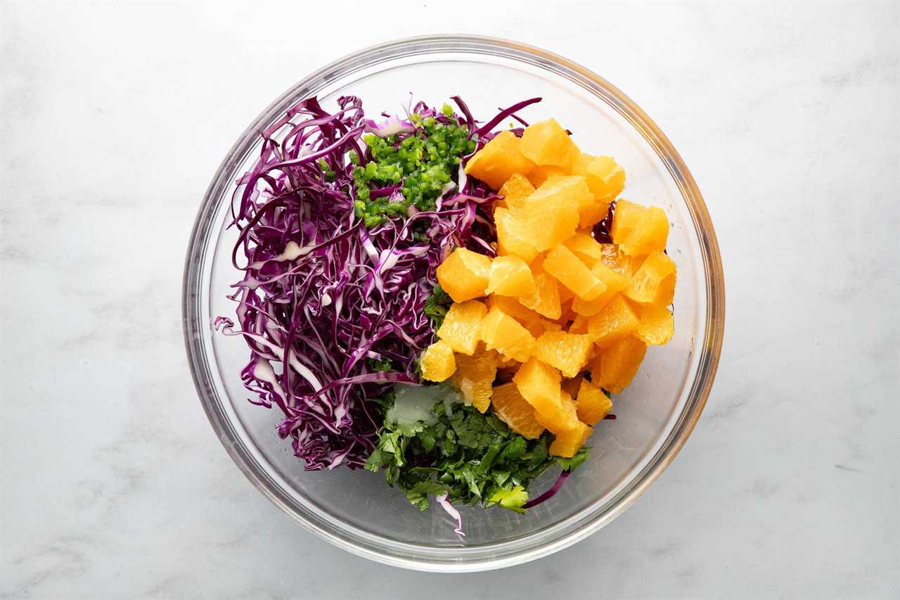 Orange salsa ingredients in a bowl.