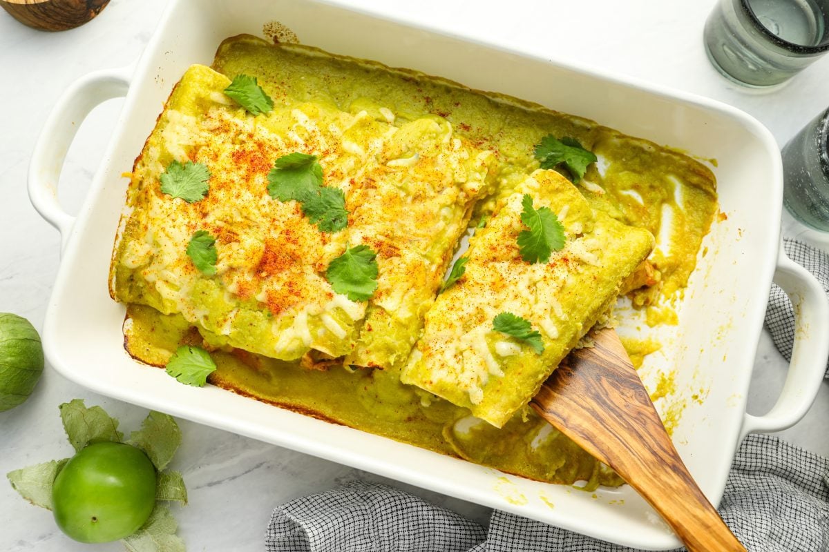 serving the chicken enchiladas.