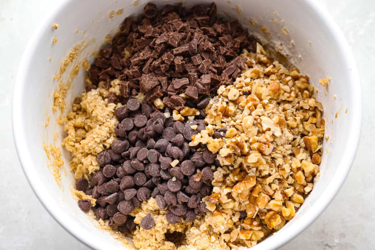 Chocolate chips, chocolate bar pieces, and chopped walnuts added to the cookie dough.