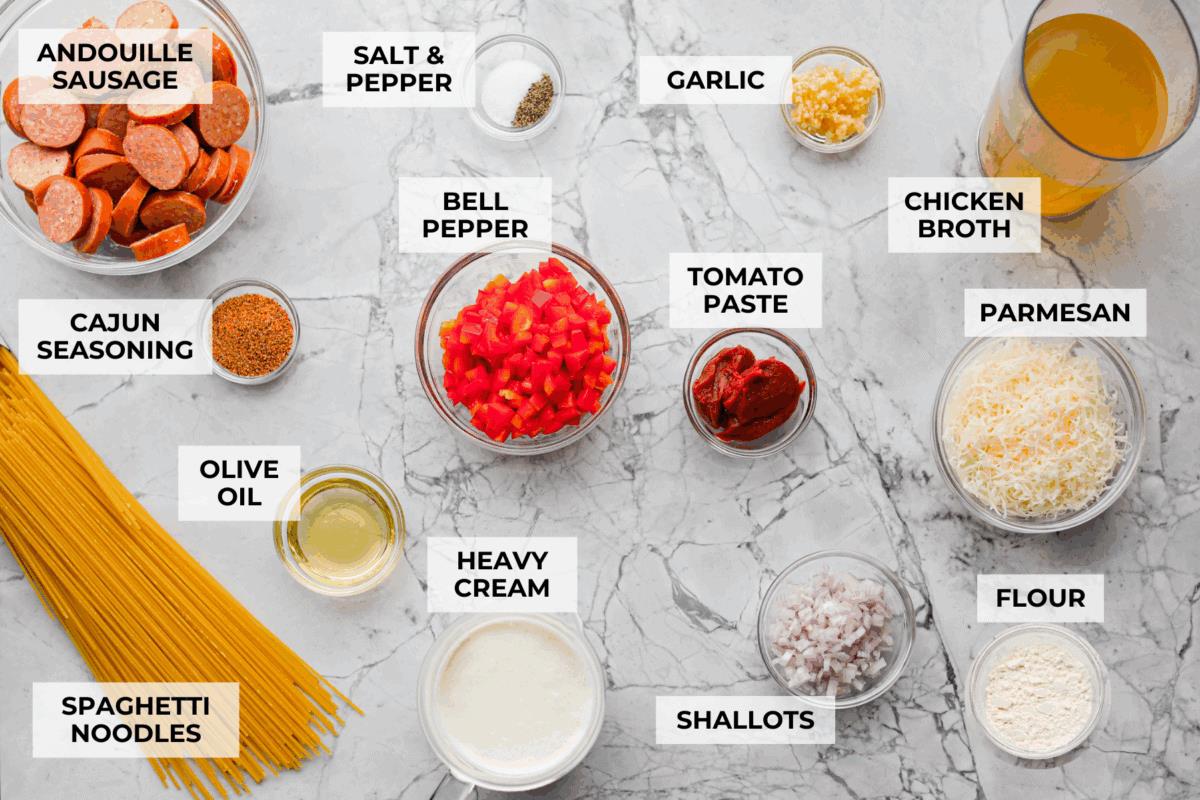 Overhead shot of labeled Cajun Spaghetti ingredients. 