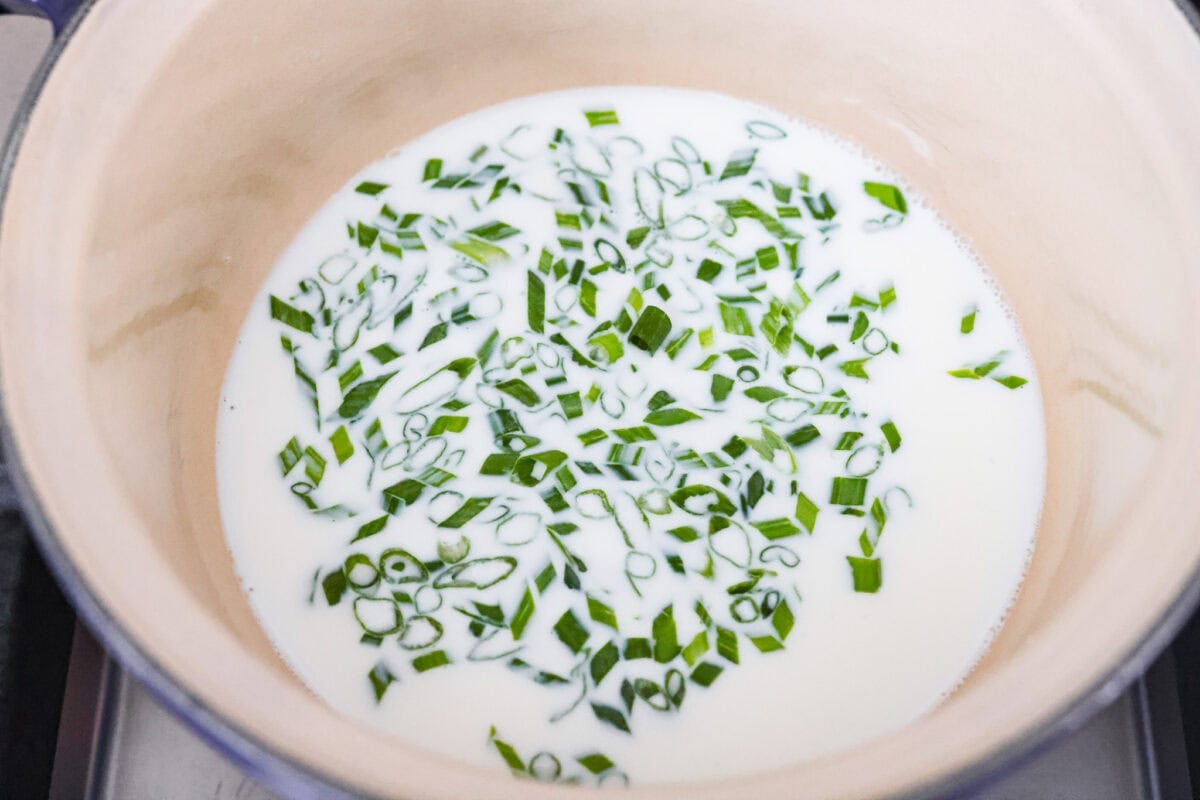 Green onions soaking in warm milk. 