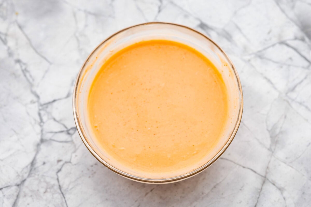 Mixing bowl full of sauce ingredients all mixed together. 