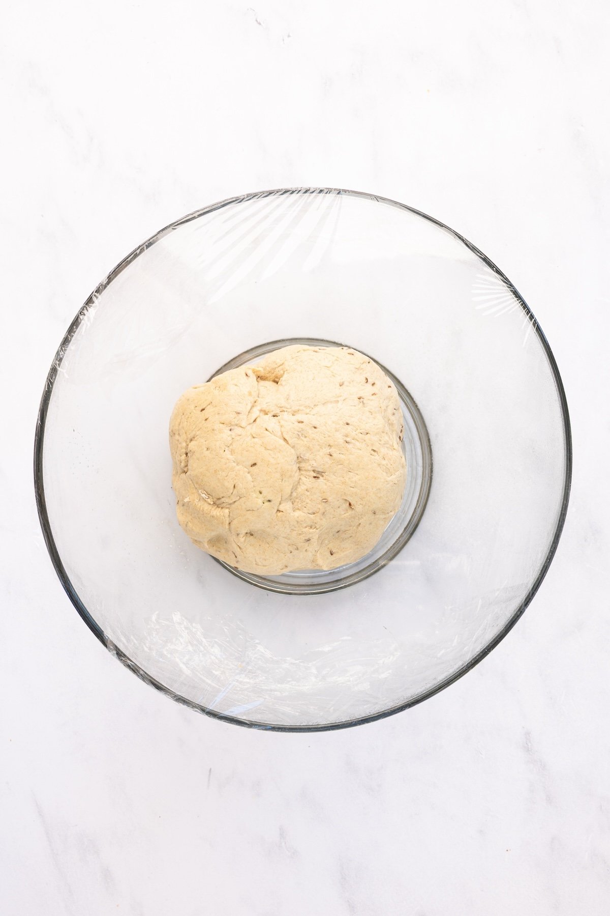 glass bowl with unrisen rye bread dough