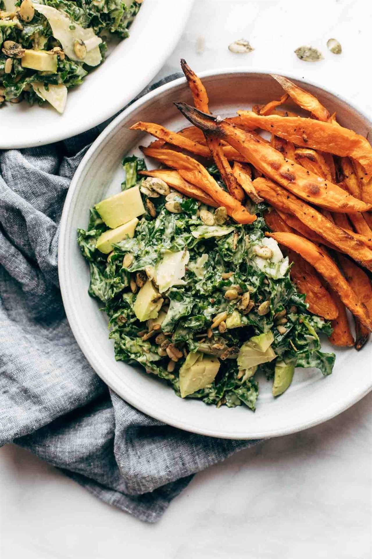 Kale salad with sweet potato fries.