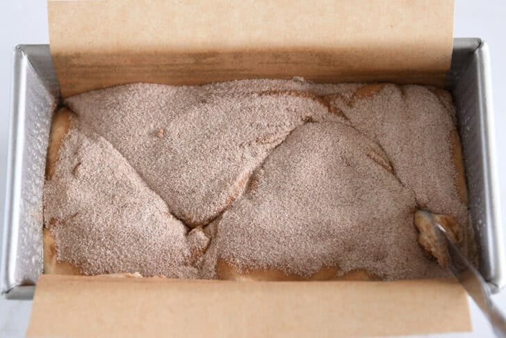 Using butter knife to make swirls in cinnamon sugar mixture and quick bread batter.