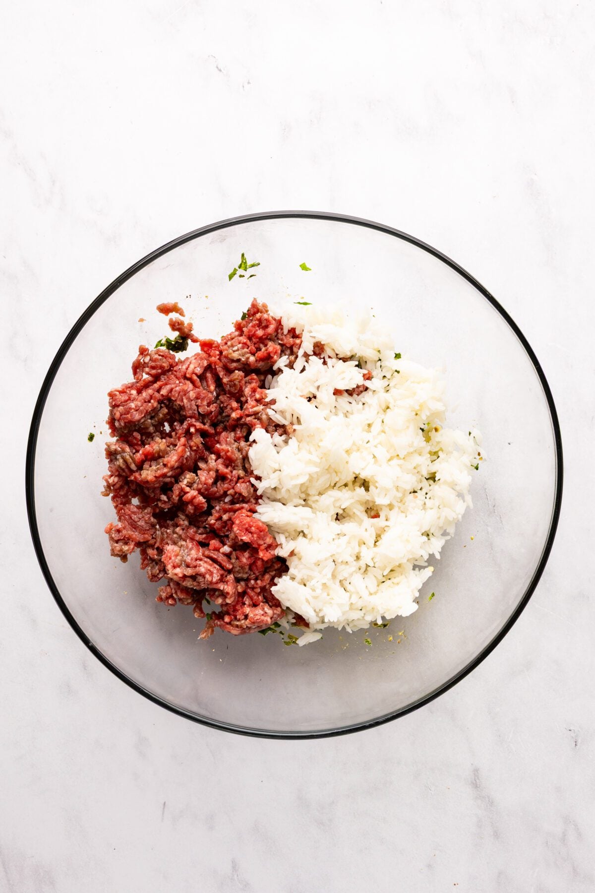 large bowl with cooked rice added to meat mixture