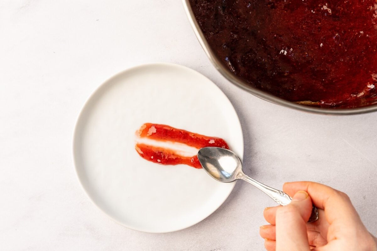 spoonful of thickened jam on white plate