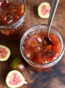 Spoon in a jar of fig jam.