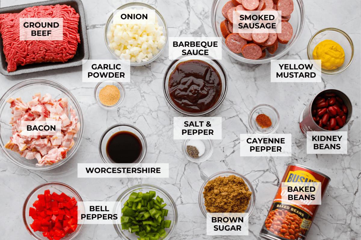 Overhead shot of labeled loaded baked beans ingredients. 