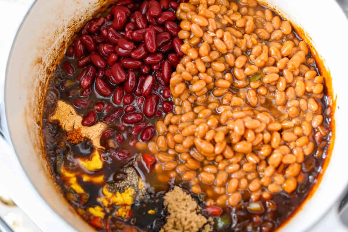 Beans and sauce ingredients added to the pot.