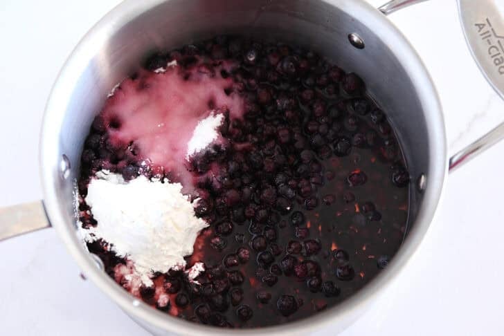 Stainless pot with huckleberries, sugar, cornstarch and lemon juice.