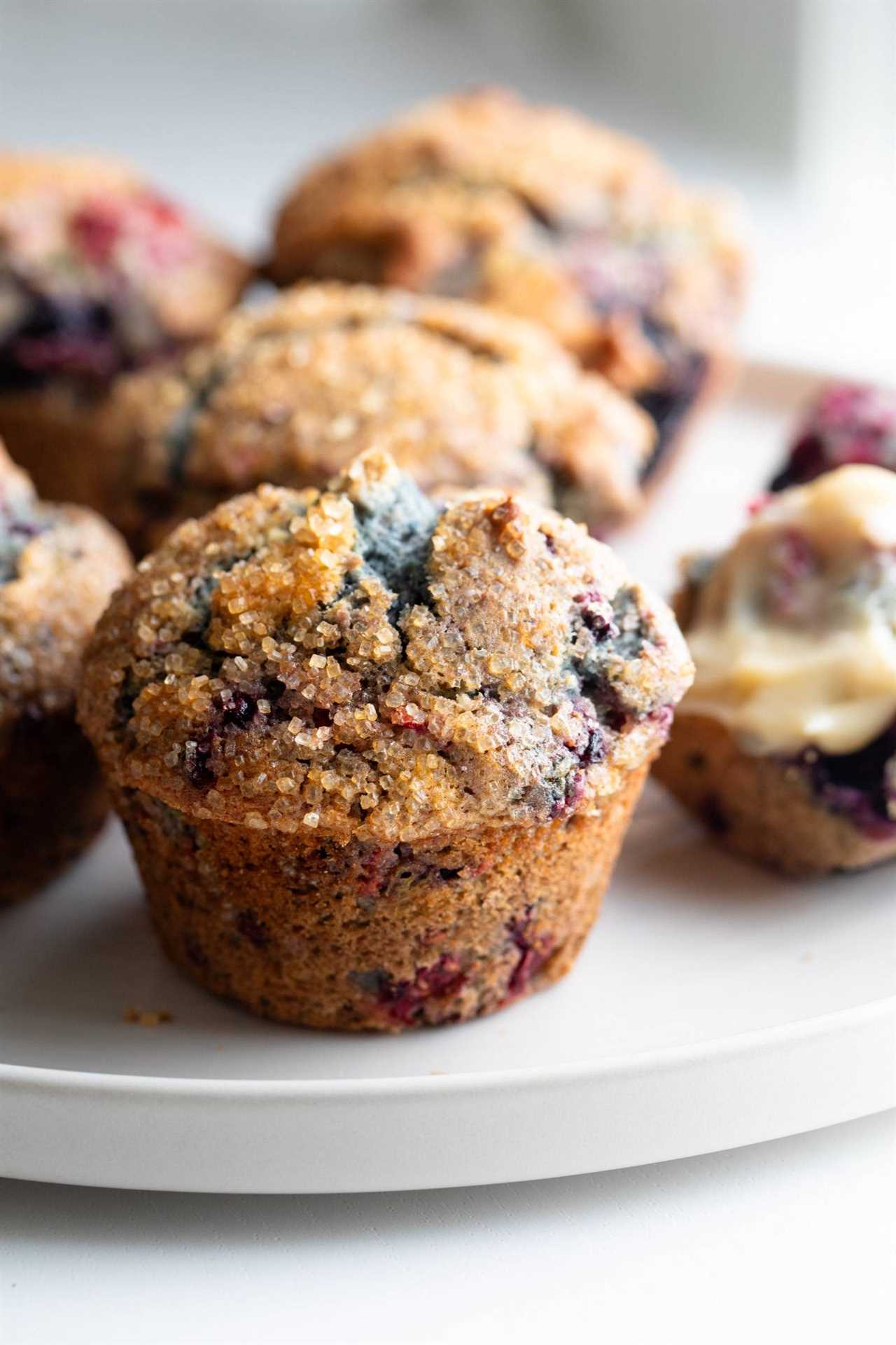 Mixed Berry Muffins on a serving plate.