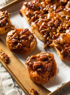 Sticky buns on parchment paper.