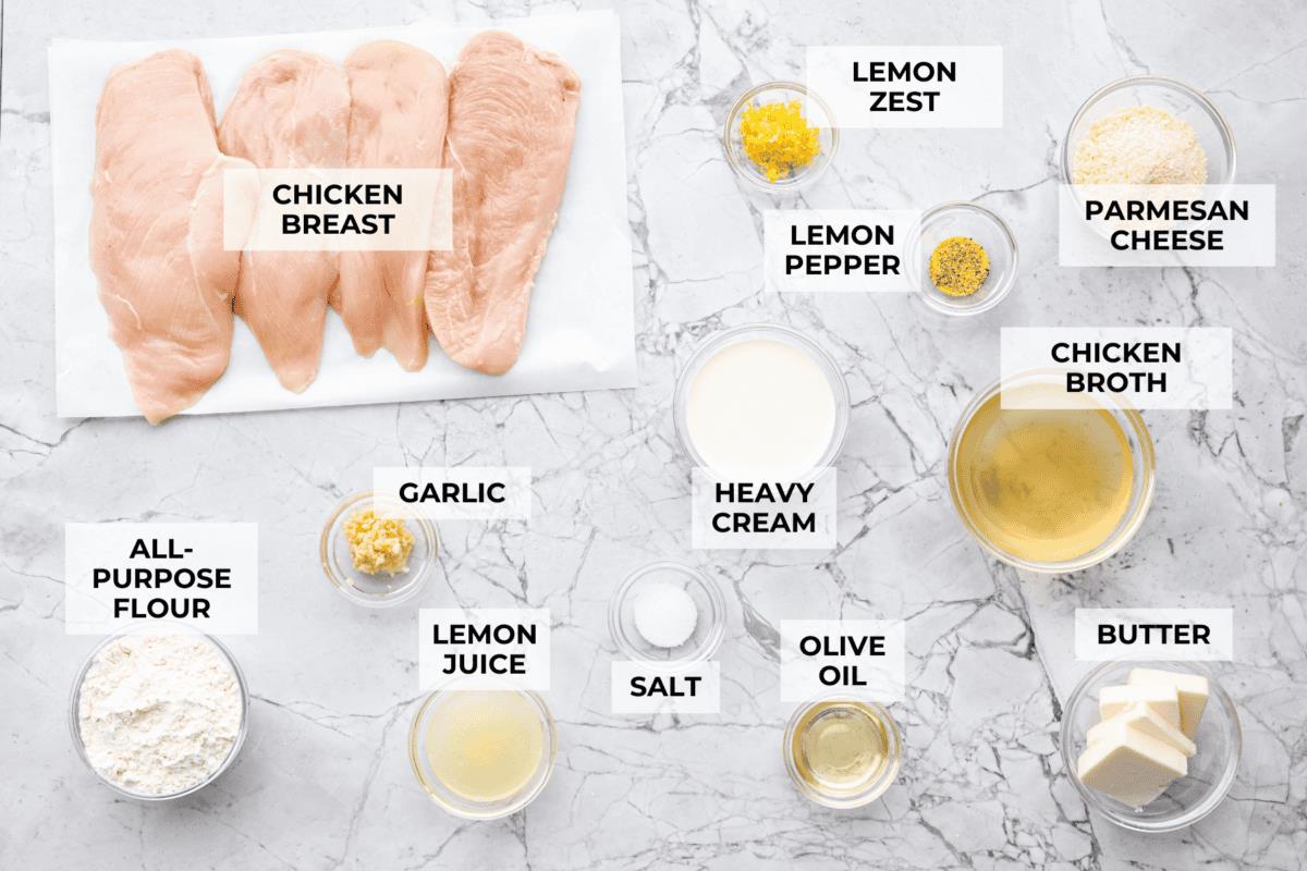 Overhead shot of labeled lemon butter chicken ingredients. 