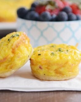 Two mini quiche from the mini quiche recipe on white napkin