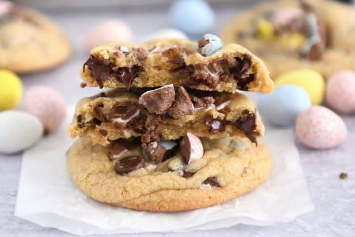 Two half cadbury egg cookies stacked on whole cookie.