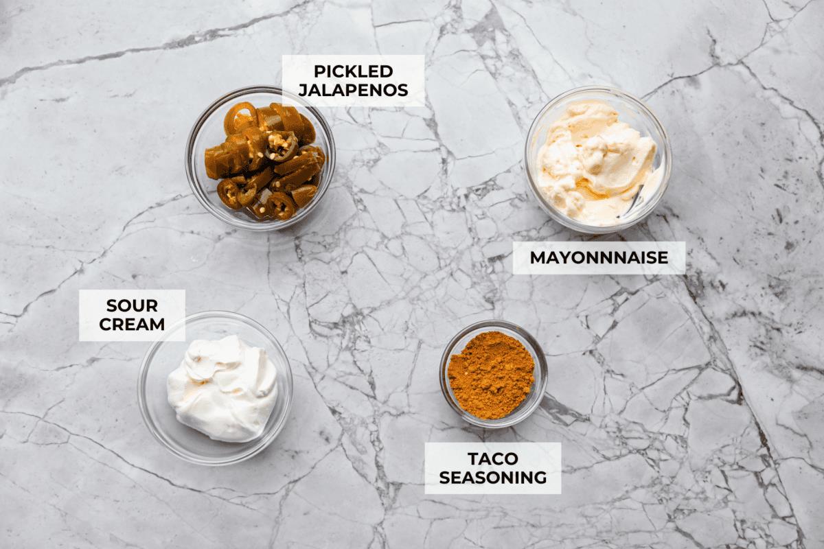 Overhead shot of labeled Taco Bell quesadilla sauce ingredients. 
