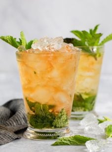 two mint juleps with linen napkin