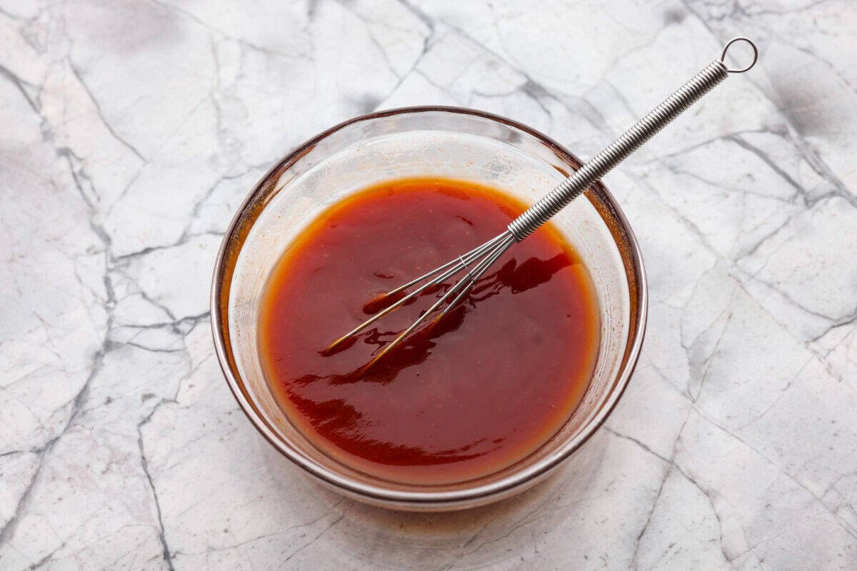 Sauce ingredients added to a bowl. 