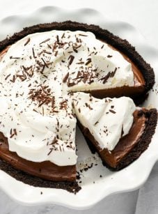 sliced chocolate cream pie with linen napkin