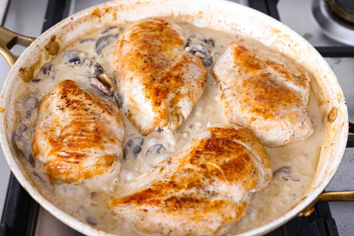 Cooked chicken added back to the skillet. 
