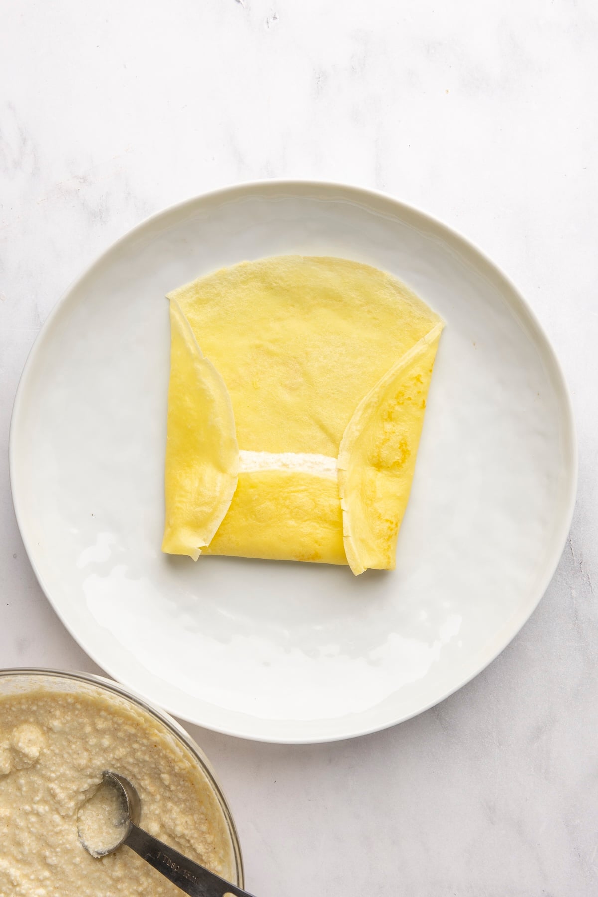 both sides of crepe folded into center