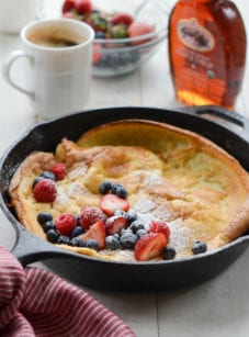 Dutch baby with fruit in a skillet.