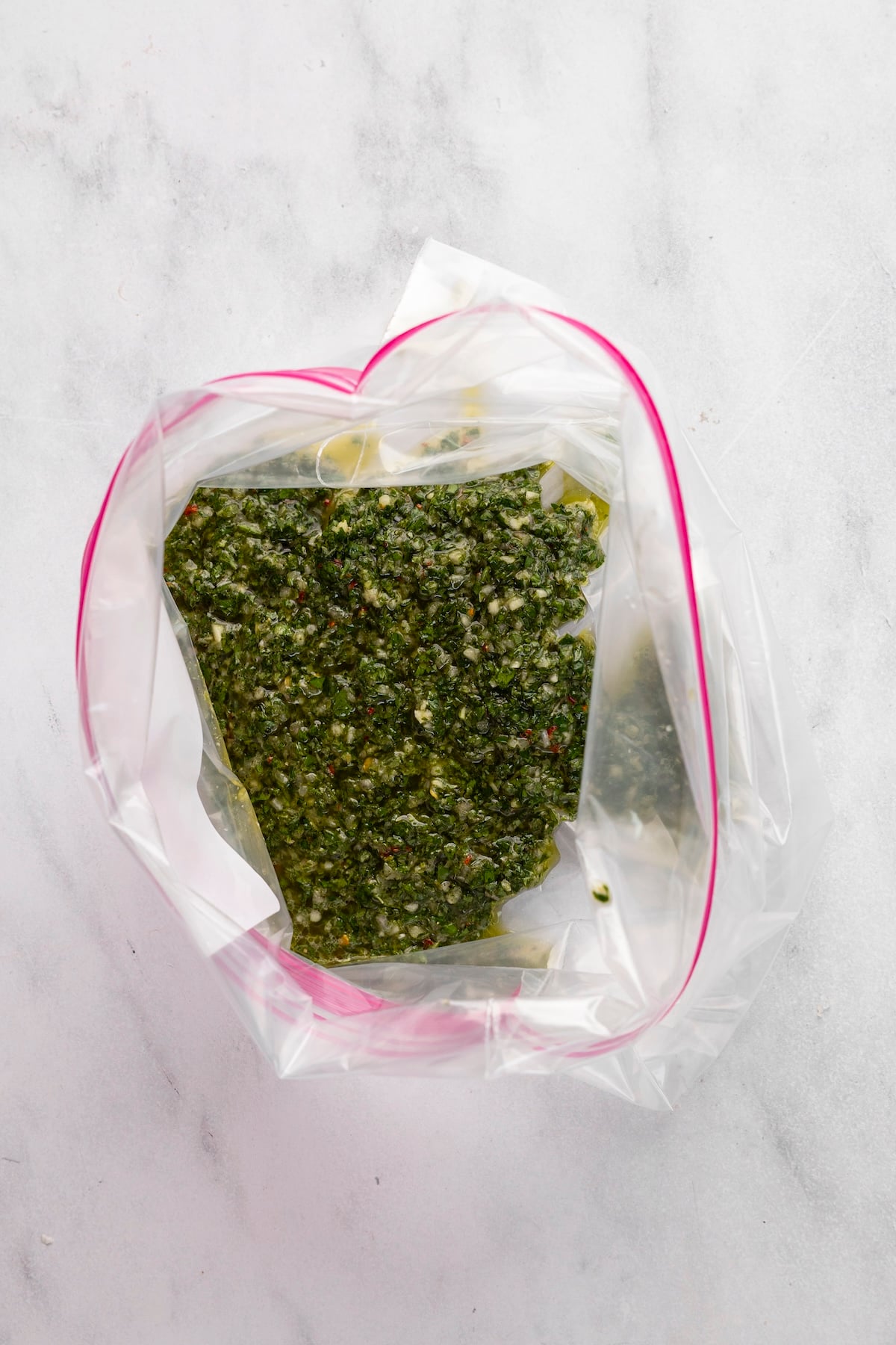 1/2 cup of chimichurri sauce in large zip-top bag