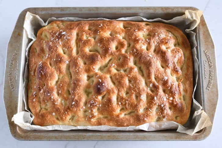 Top down view of baked focaccia bread in 9X13-inch pan.