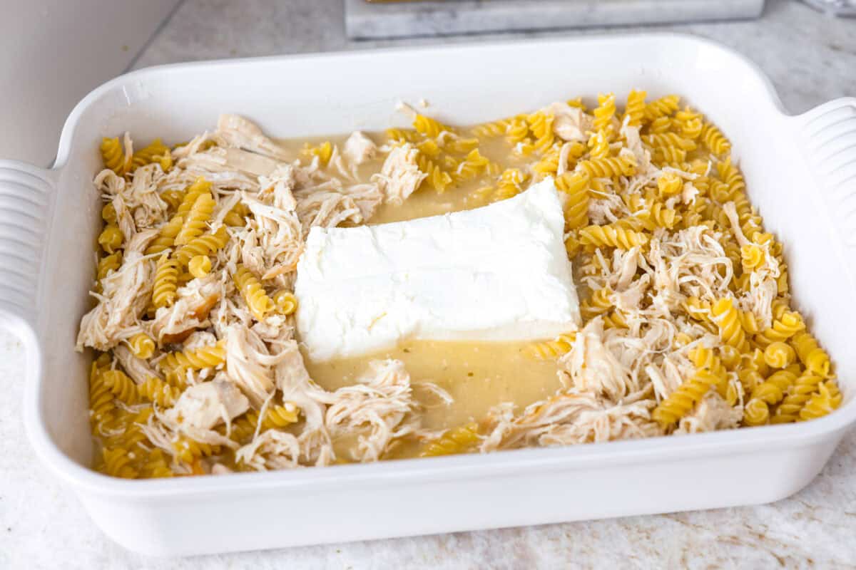 Block of cream cheese added to the pasta and chicken and dressing. 