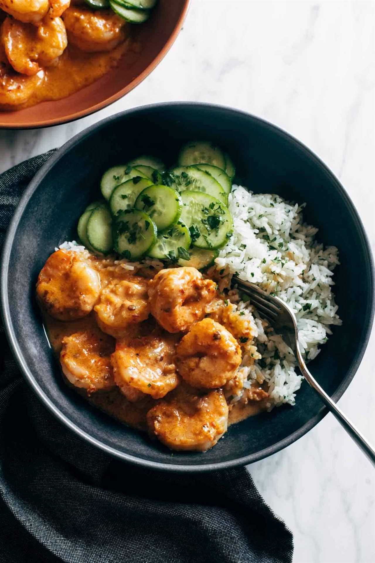 Chipotle orange shrimp with rice and cucumbers.