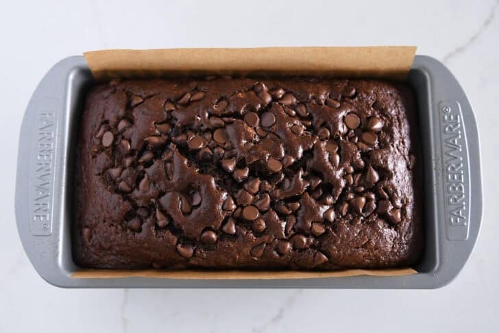 Top down view of baked loaf of chocolate banana bread.