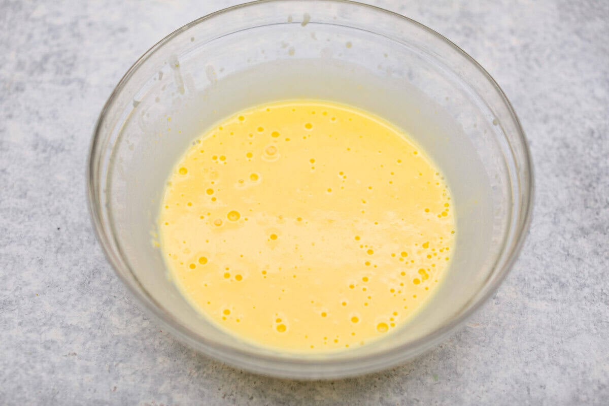 Vanilla pudding and milk mixed together in a bowl. 