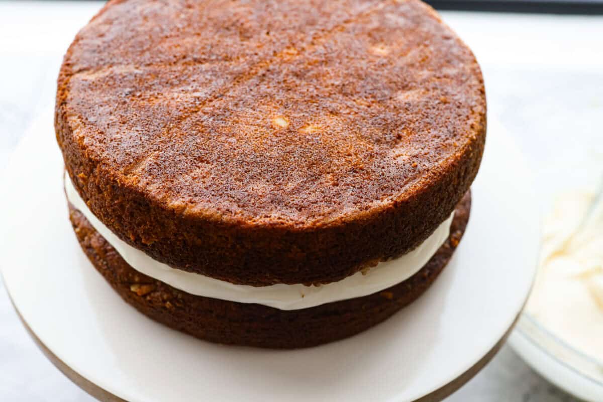 Second layer of cake added to on top of the layer of frosting. 