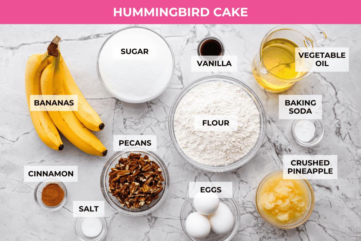 Overhead shot of labeled hummingbird cake ingredients. 