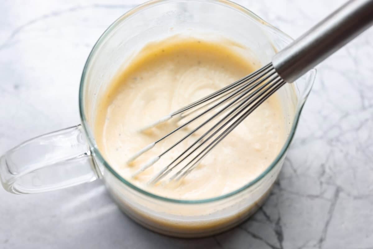 All of the dressing ingredients whisked together in a pourable cup. 