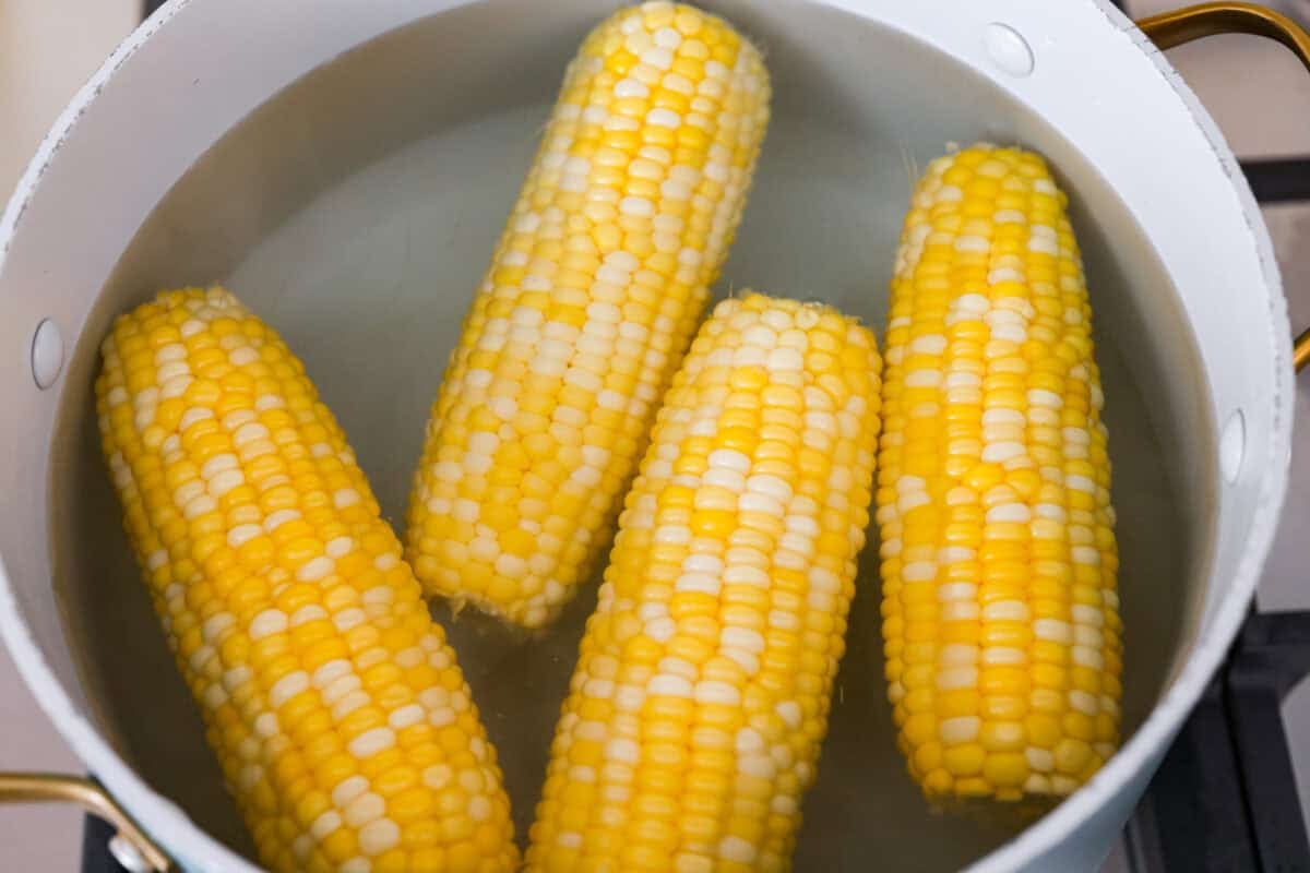 Corn in the pot of boiling water. 