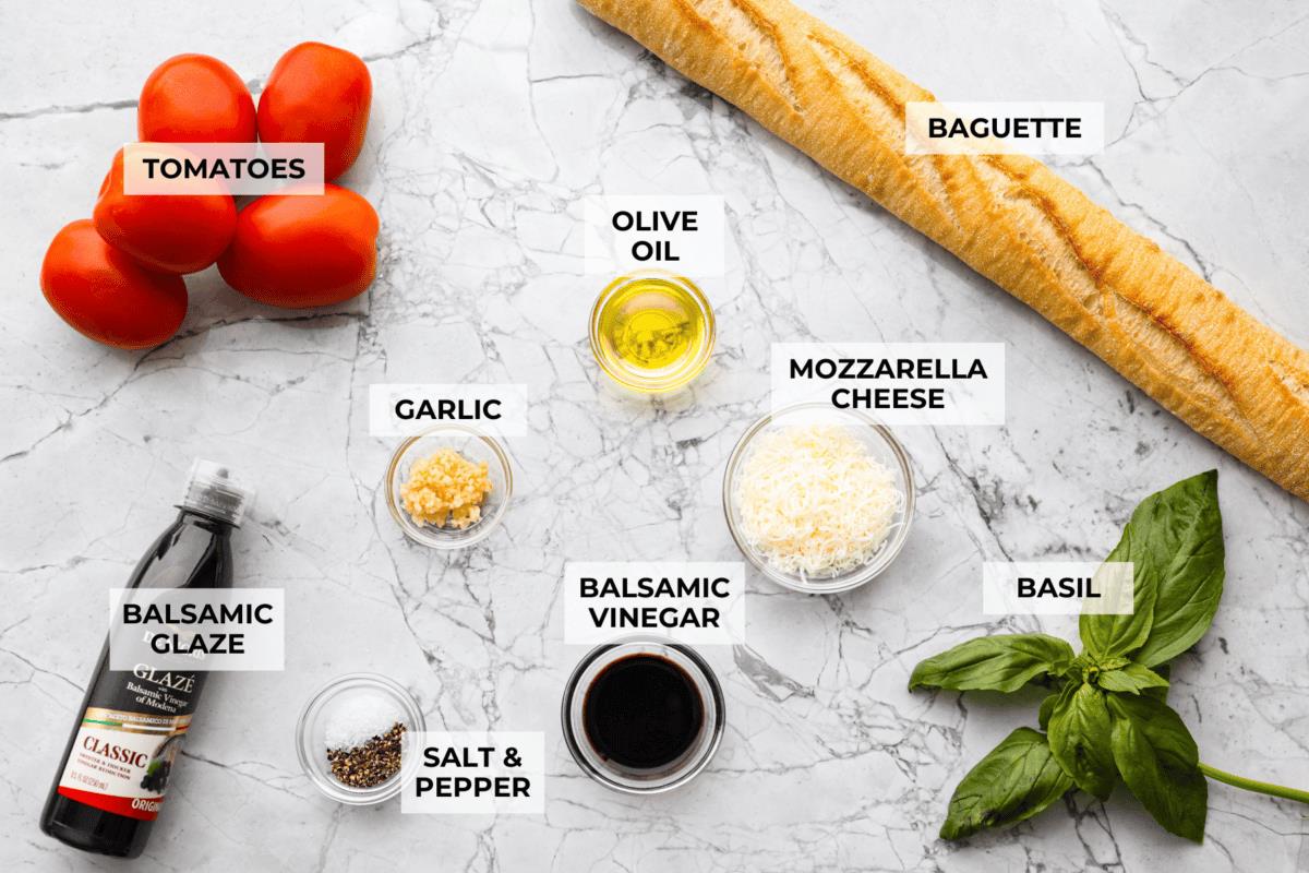 Overhead shot of labeled bruschetta ingredients. 