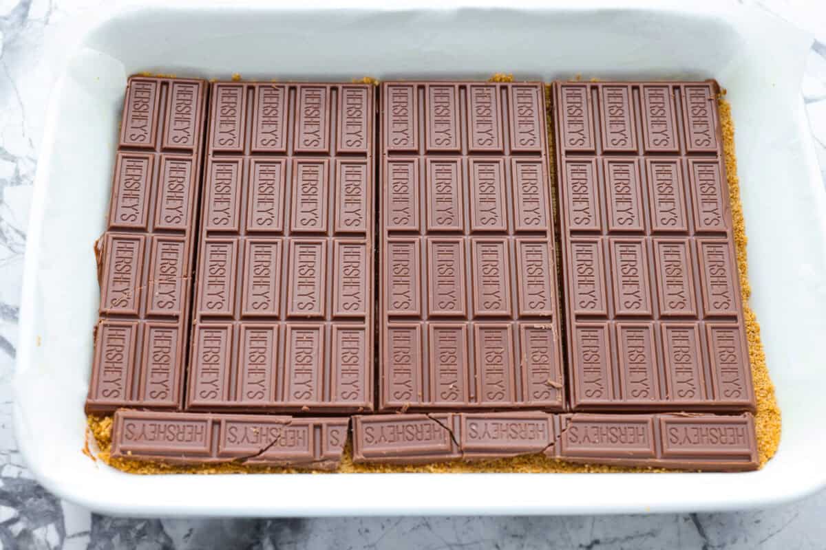 Chocolate bars added to the top of the graham cracker crust. 
