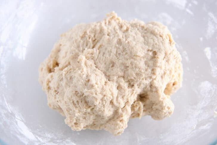 Glass bowl with mixed mass of fry bread dough.