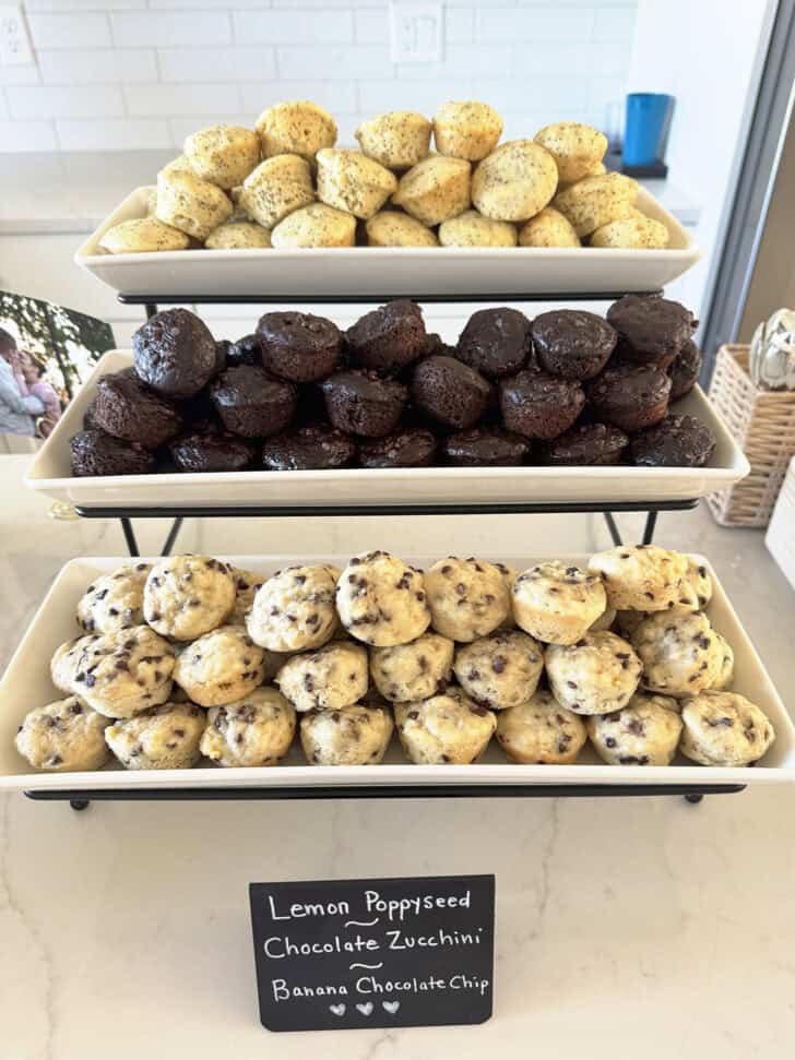 White tiered tray with a variety of mini muffins.