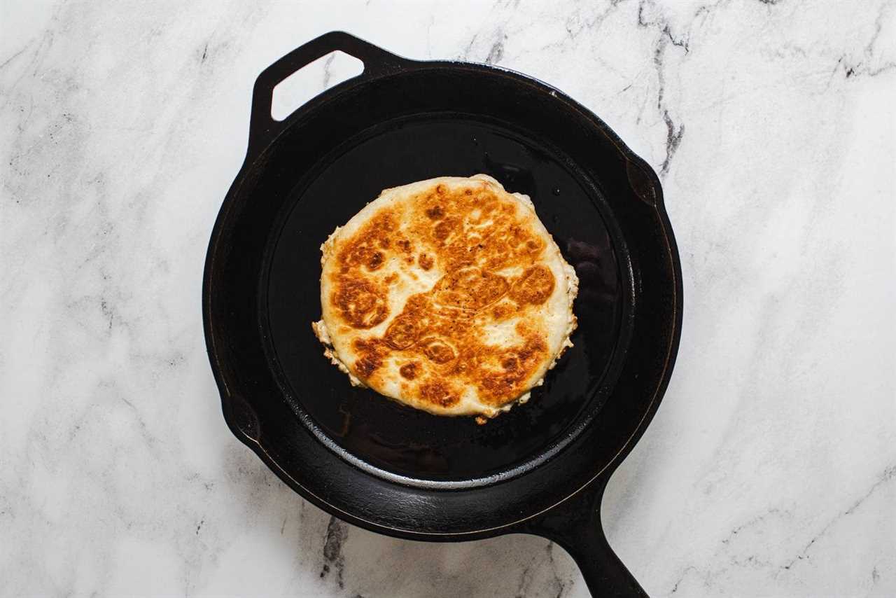 Frying smash tacos in a skillet.