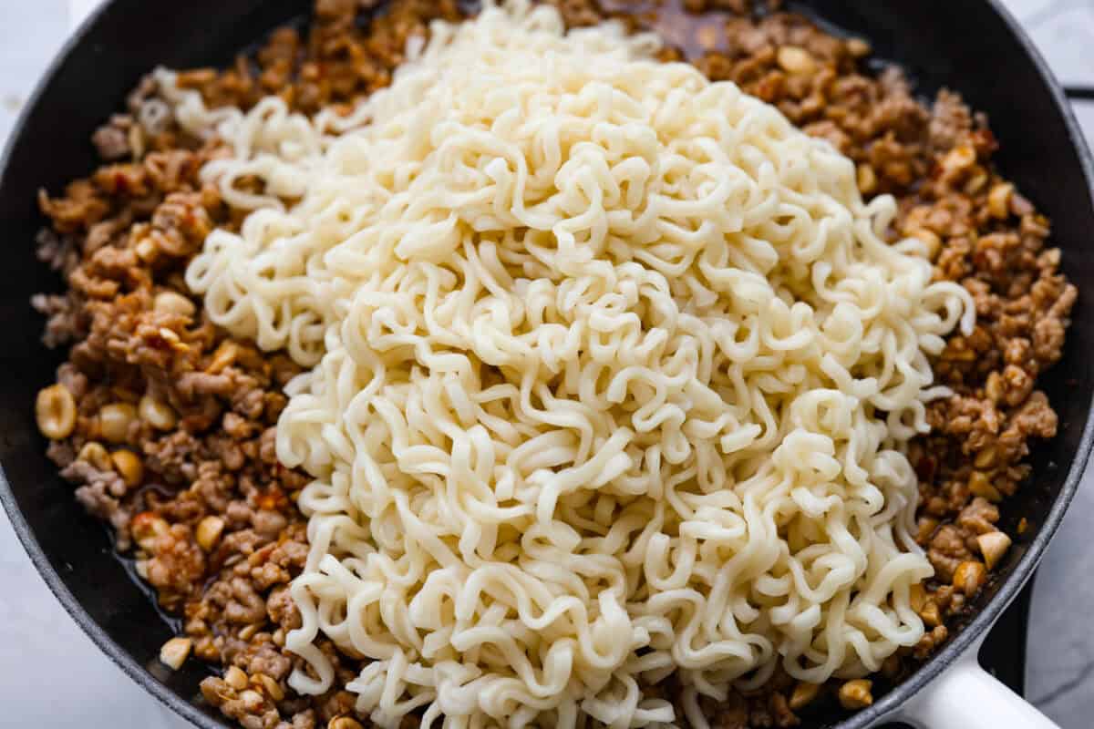 Noodles added to the meat and sauce mixture. 