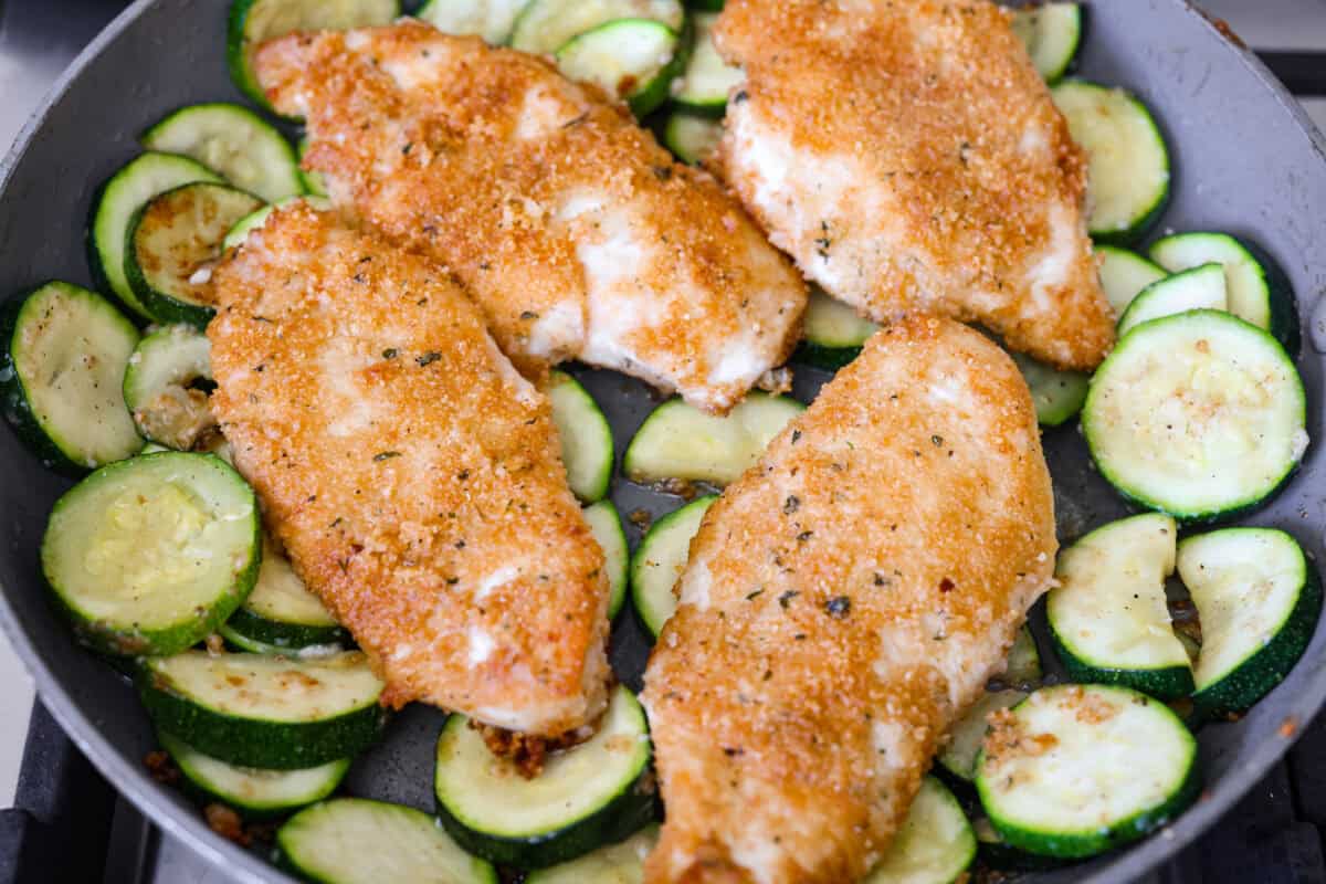Cooked chicken added back to the skillet. 