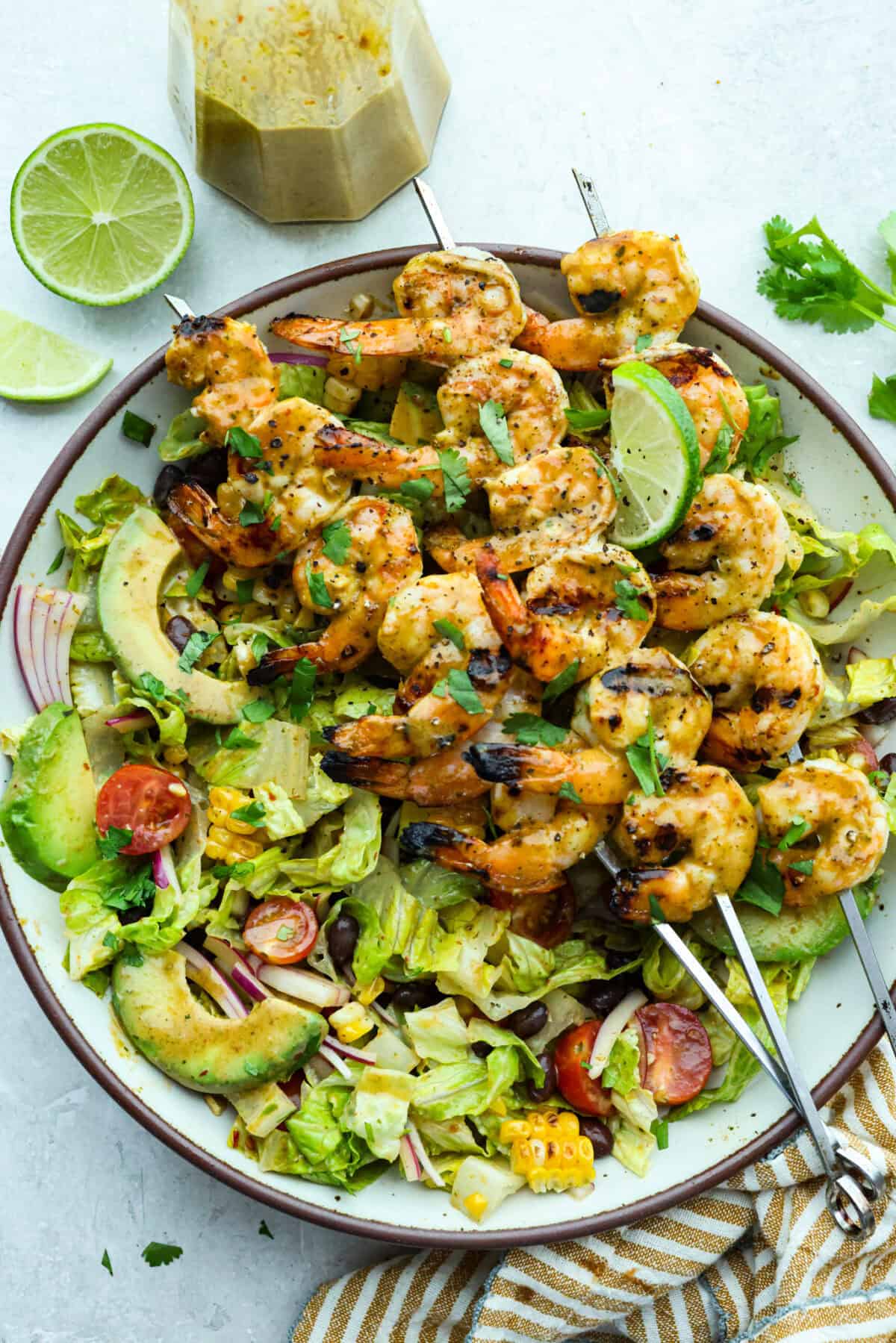 Large plate of grilled shrimp salad. 