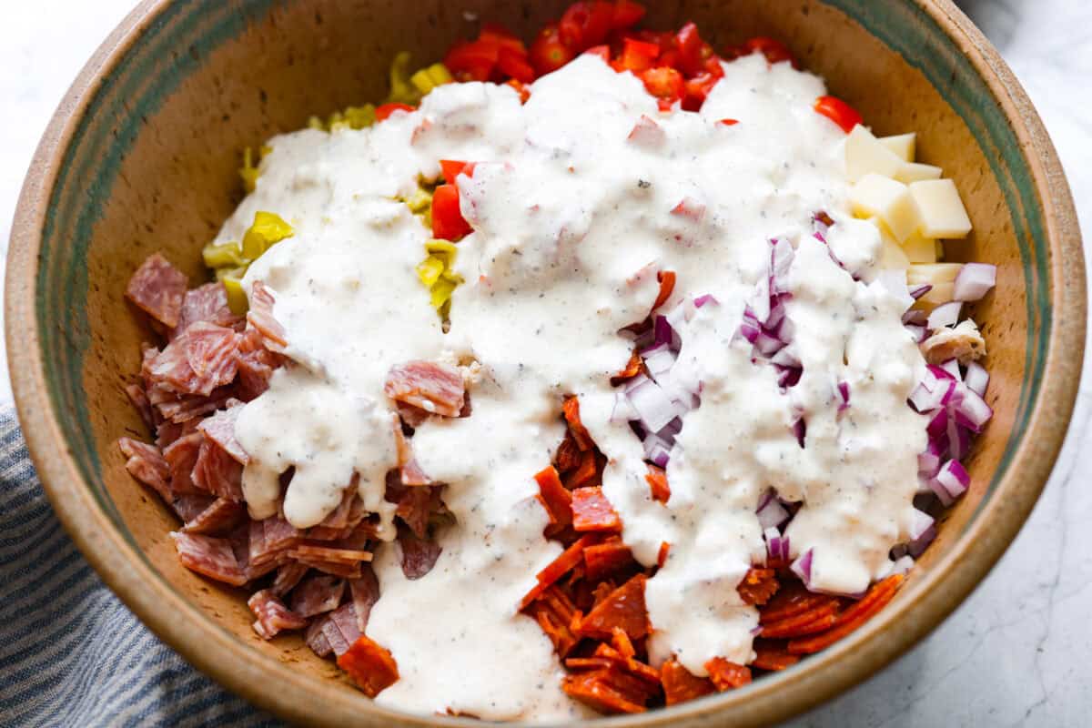 Dressing added to the top of the salad ingredients. 