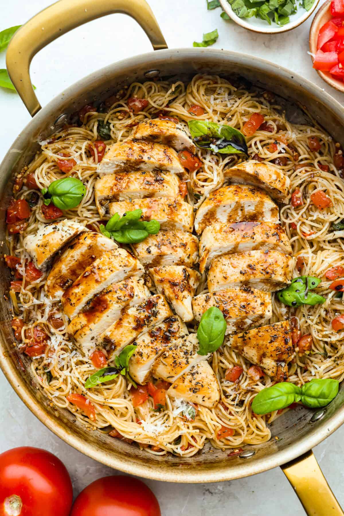 Fresh bruschetta chicken pasta in a skillet. 