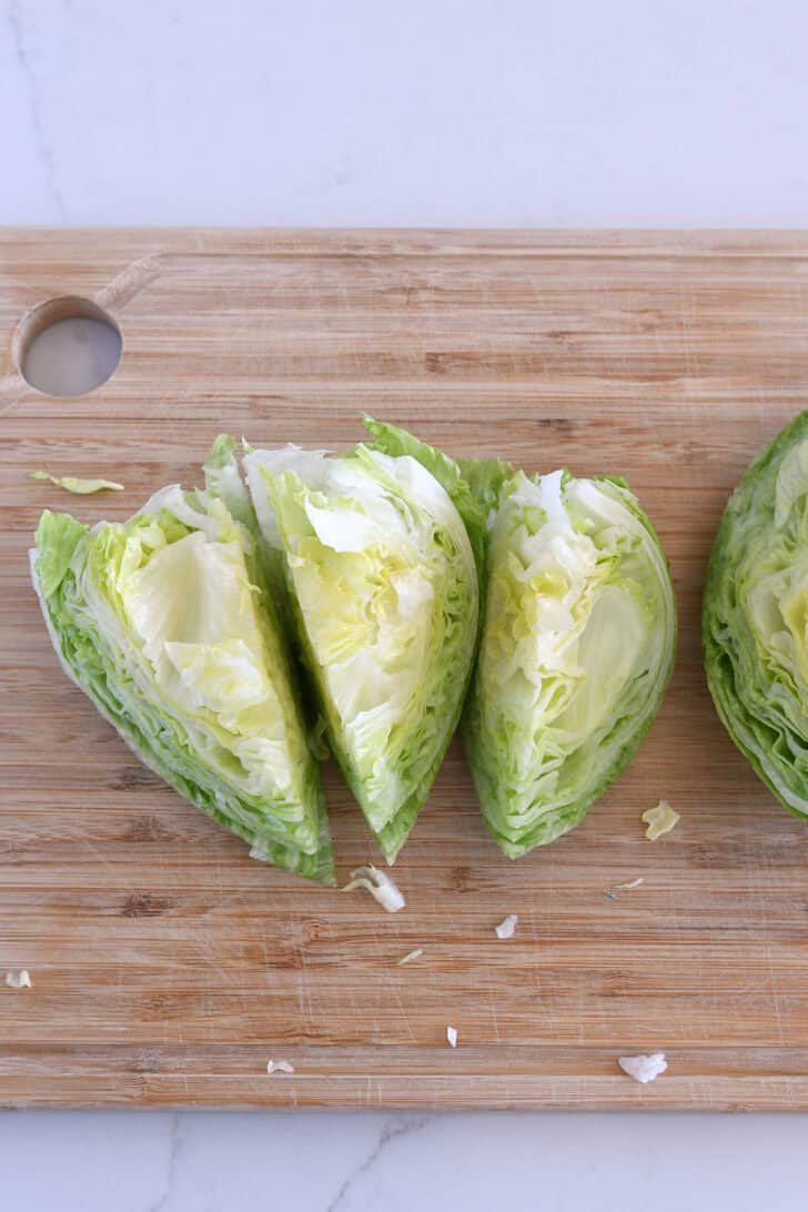 Wood cutting board with iceberg wedges.