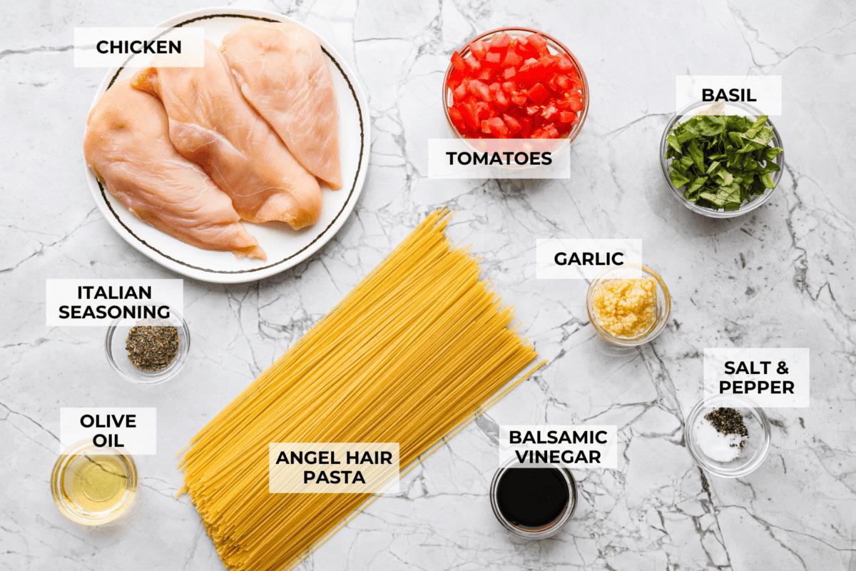 Overhead shot of labeled bruschetta chicken ingredients. 