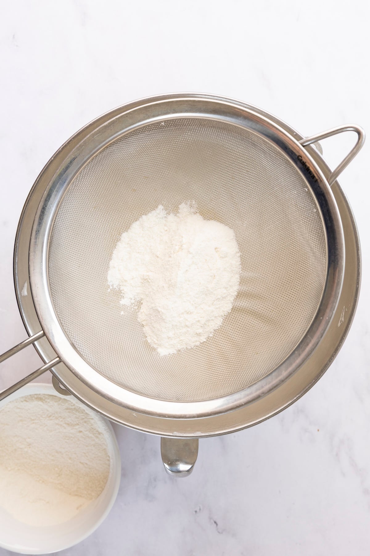 Flour/sugar mixture sifted into egg white mixture.